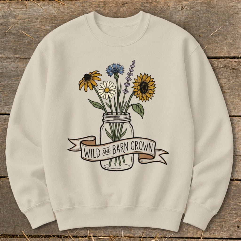 Cream sweatshirt with wildflowers in a mason jar and "Wild and Barn Grown" banner.