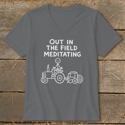 Gray t-shirt with white text "Out in the Field Meditating" and a drawing of a tractor.