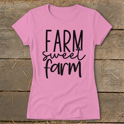 Pink t-shirt with black text reading "FARM sweet farm".