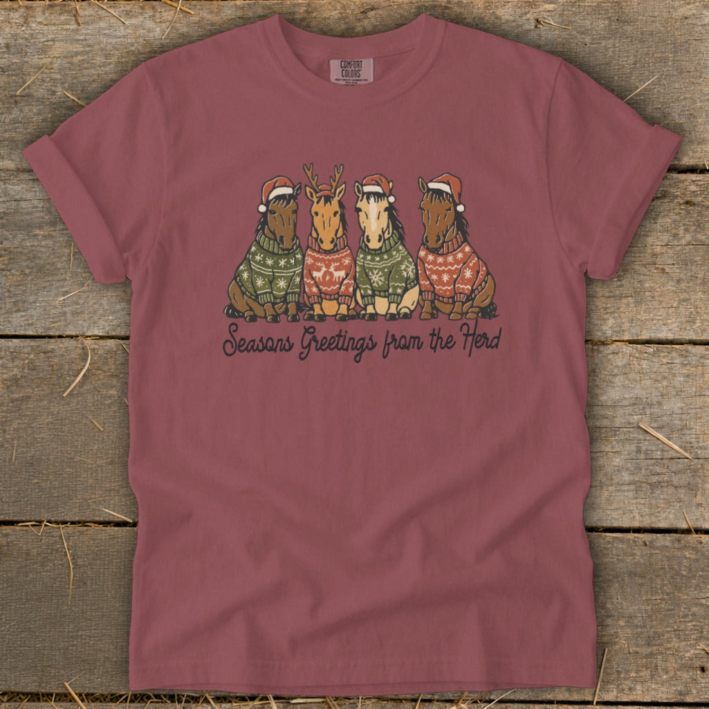 Four horses in Santa hats and sweaters with "Seasons Greetings from the Herd" text.