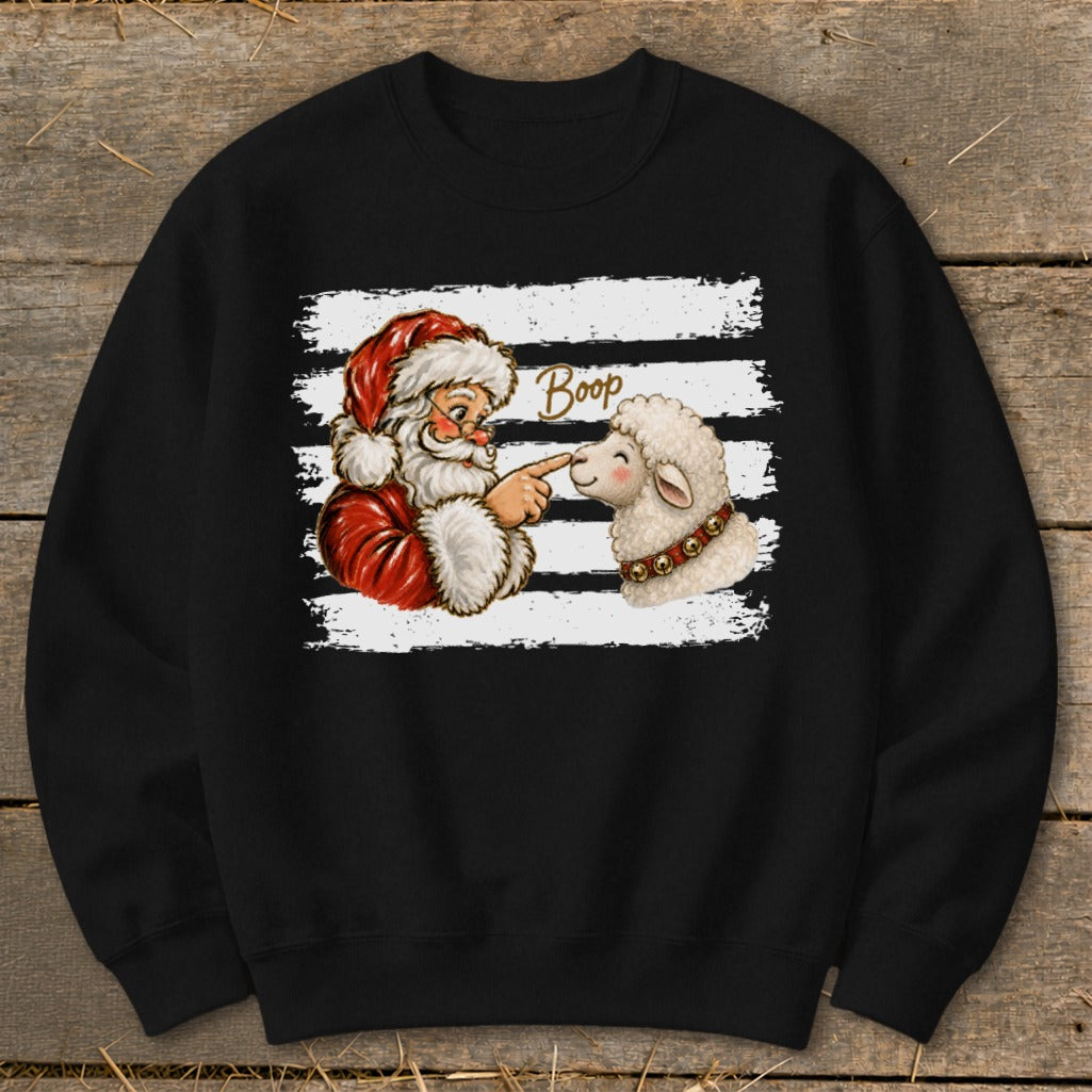 Santa booping a sheep with "Boop" text on a black sweatshirt.
