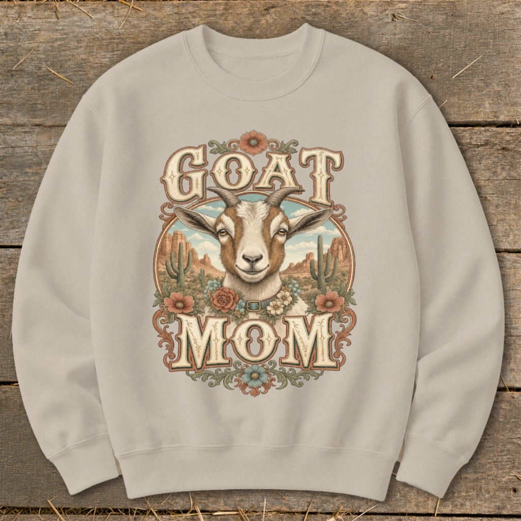 Crewneck sweatshirt with "GOAT MOM" text and a goat's head in a desert landscape.