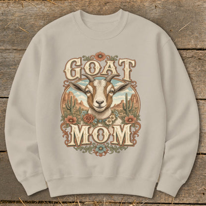 Crewneck sweatshirt with "GOAT MOM" text and a goat's head in a desert landscape.