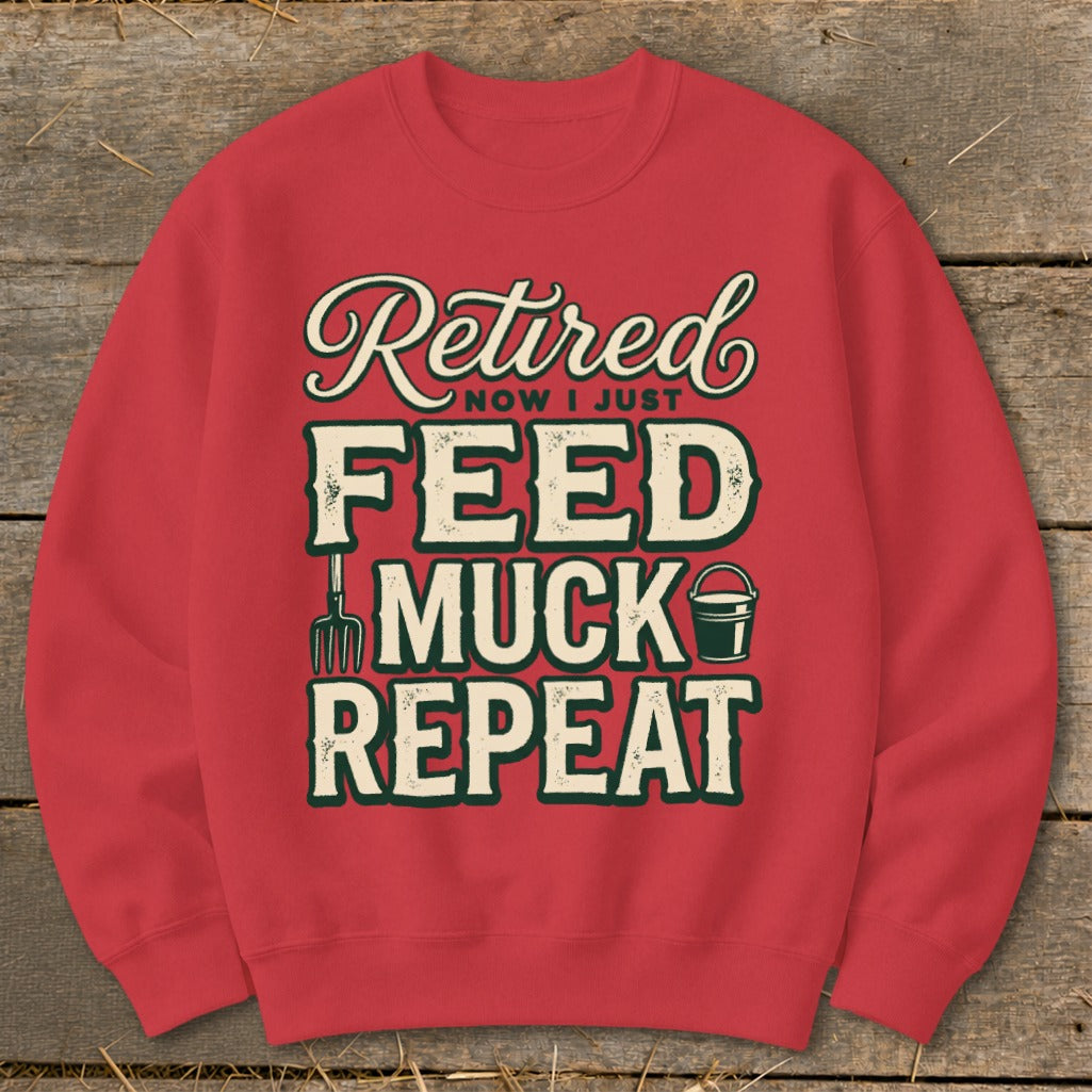 Red sweatshirt with "Retired Now I Just Feed Muck Repeat" text and farm graphics.