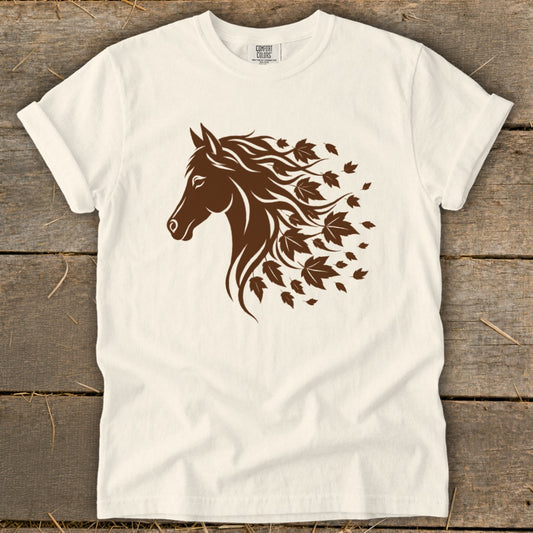 Cream t-shirt with brown horse head and flowing mane of leaves.