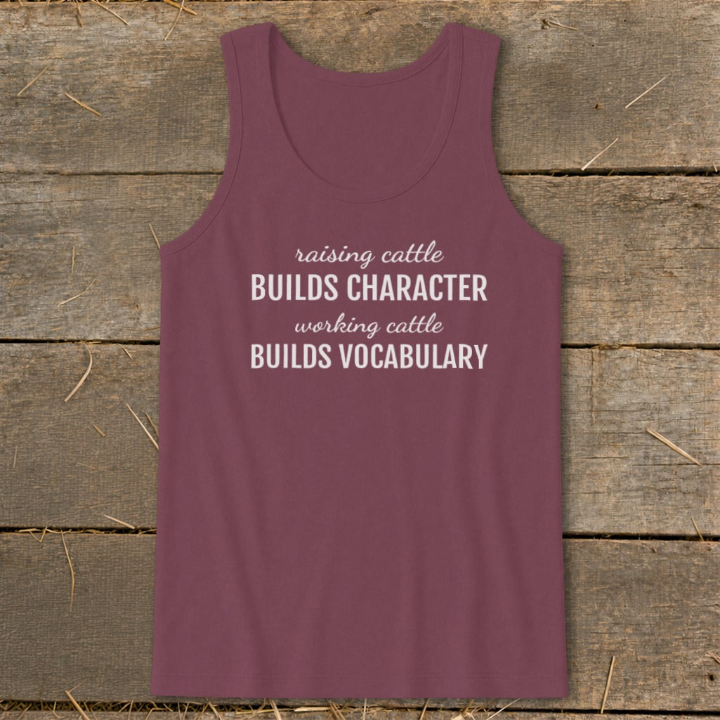Maroon tank top with white text: "raising cattle BUILDS CHARACTER working cattle BUILDS VOCABULARY".