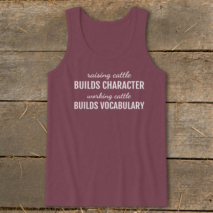 Maroon tank top with white text: "raising cattle BUILDS CHARACTER working cattle BUILDS VOCABULARY".