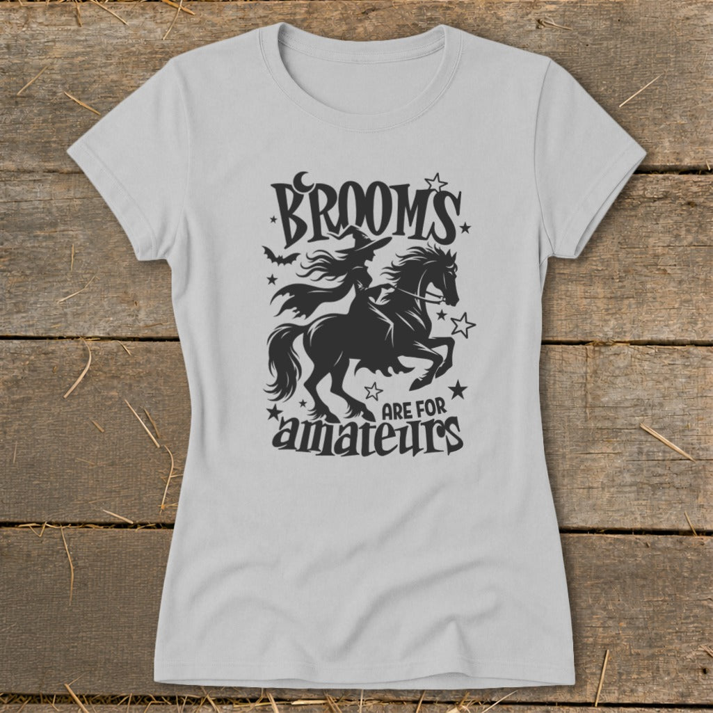 Gray t-shirt with black graphic of a witch riding a horse, bats, moon, and stars with text.