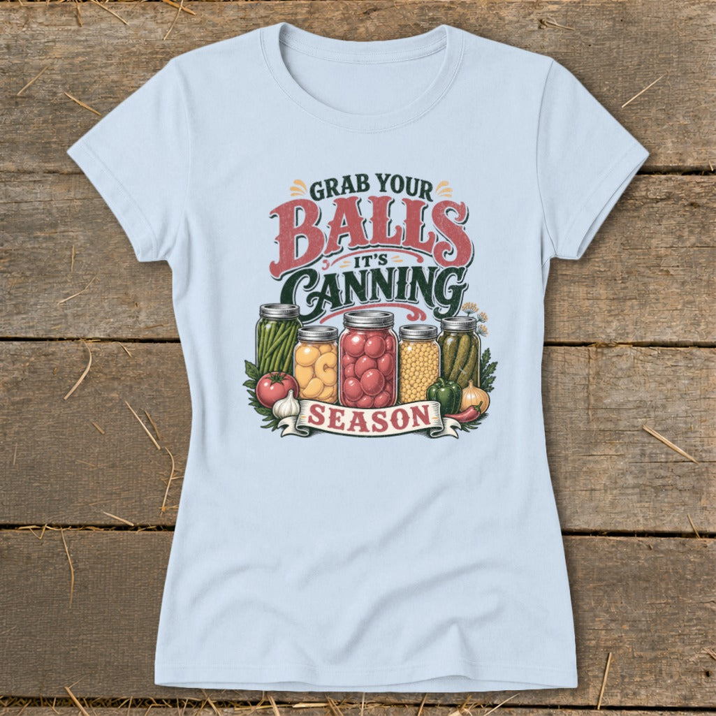 Light blue t-shirt with "Grab Your Balls It's Canning Season" text and jars of preserved food.