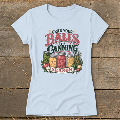 Light blue t-shirt with "Grab Your Balls It's Canning Season" text and jars of preserved food.