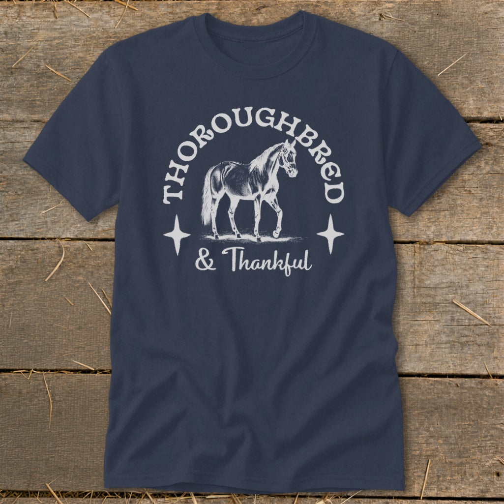Navy t-shirt with a horse graphic and text "THOROUGHBRED & Thankful".