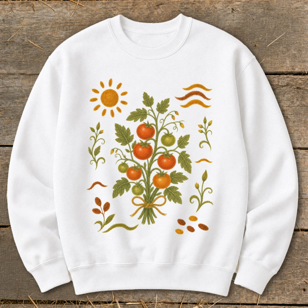 White sweatshirt with a graphic of a tomato plant, sun, and decorative elements.
