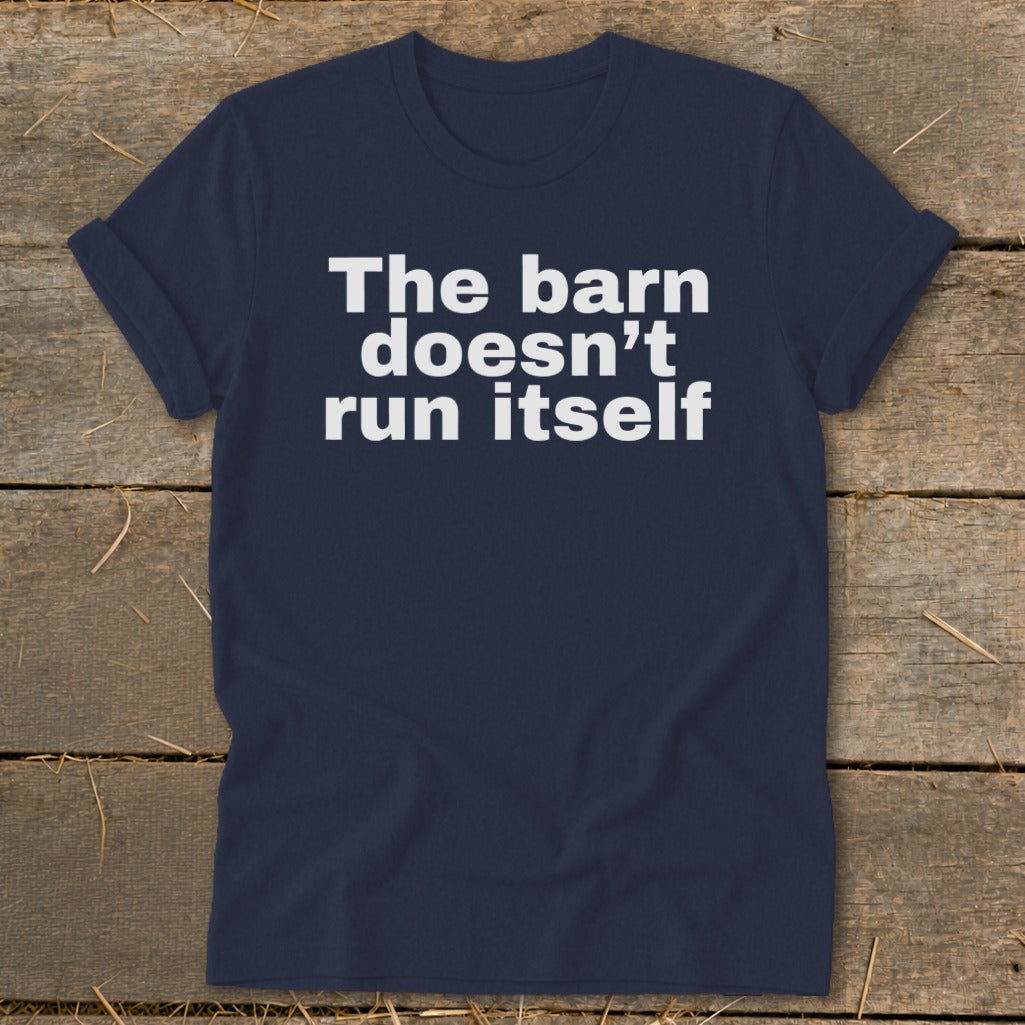 Navy t-shirt with white text reading "The barn doesn't run itself."