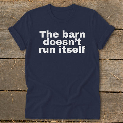 Navy t-shirt with white text reading "The barn doesn't run itself."