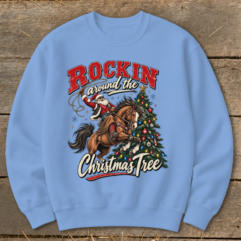 Santa on horseback lassoing near a decorated Christmas tree with "Rockin around the Christmas Tree" text.