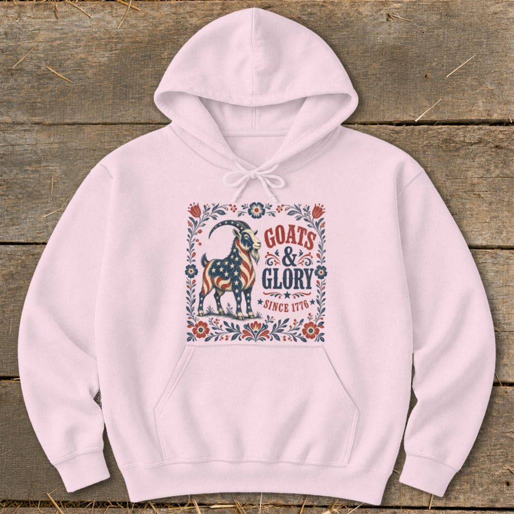 Pink hoodie with a graphic of a goat with the American flag and text "GOATS & GLORY SINCE 1776".