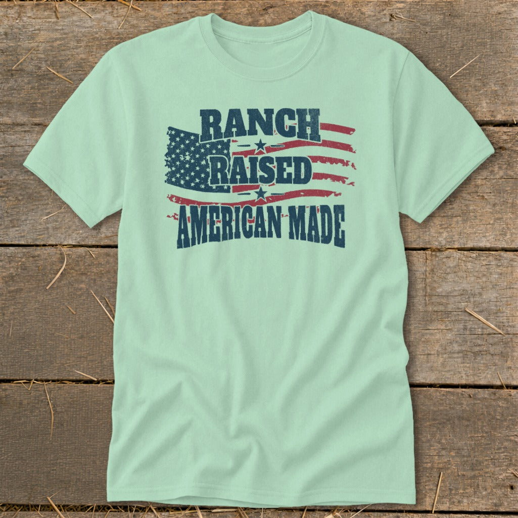 Light mint t-shirt with distressed American flag and text: RANCH RAISED AMERICAN MADE.