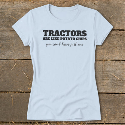 Light blue t-shirt with black text: "TRACTORS ARE LIKE POTATO CHIPS you can't have just one".