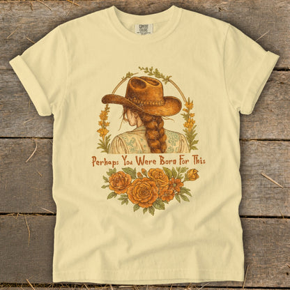 Woman with cowboy hat and braid, floral wreath, and text "Perhaps You Were Born For This".