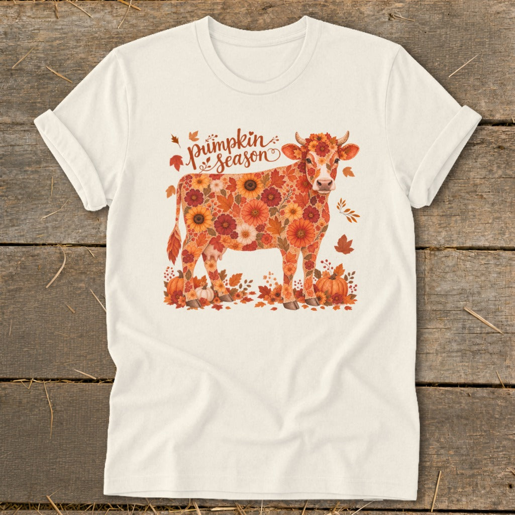 Cow covered in autumn flowers and leaves with "Pumpkin Season" text.