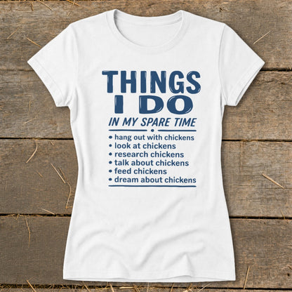 White t-shirt with blue text listing chicken-related activities in spare time.