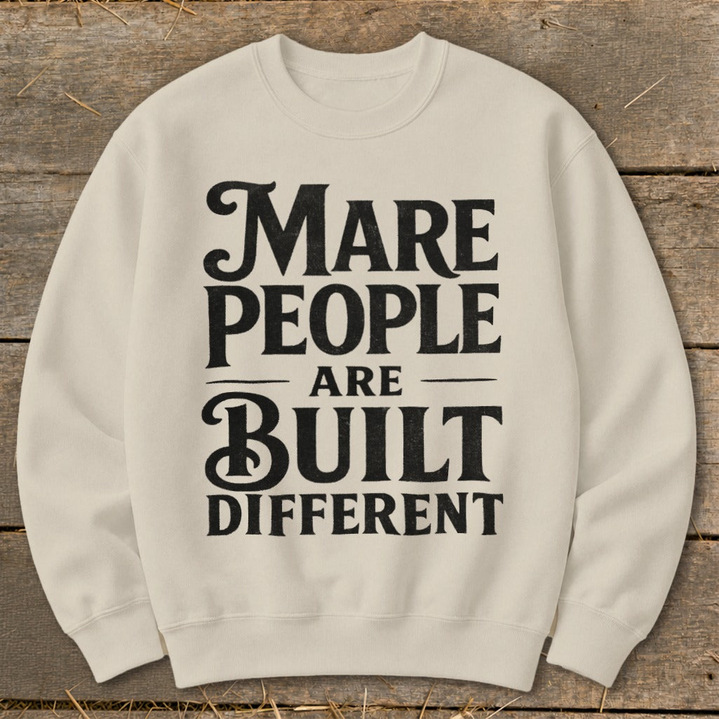 Cream sweatshirt with black text that reads "Mare People Are Built Different."