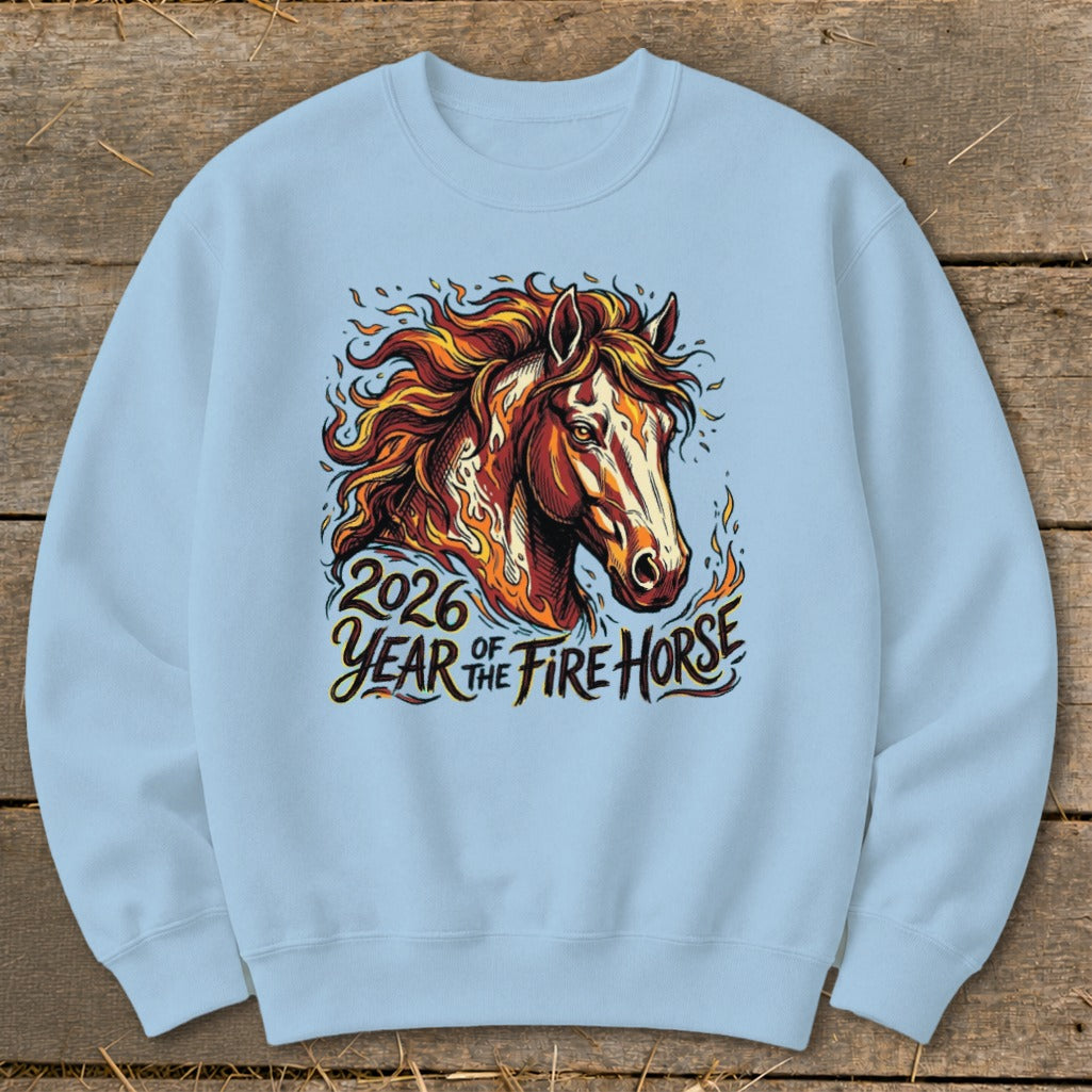 Light blue sweatshirt featuring a fiery horse graphic with text "2026 Year of the Fire Horse".