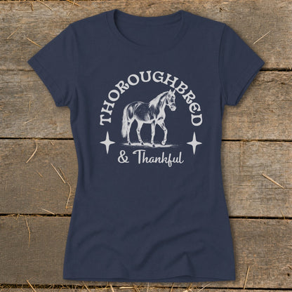 Navy t-shirt with a graphic of a horse and the text "THOROUGHBRED & Thankful."