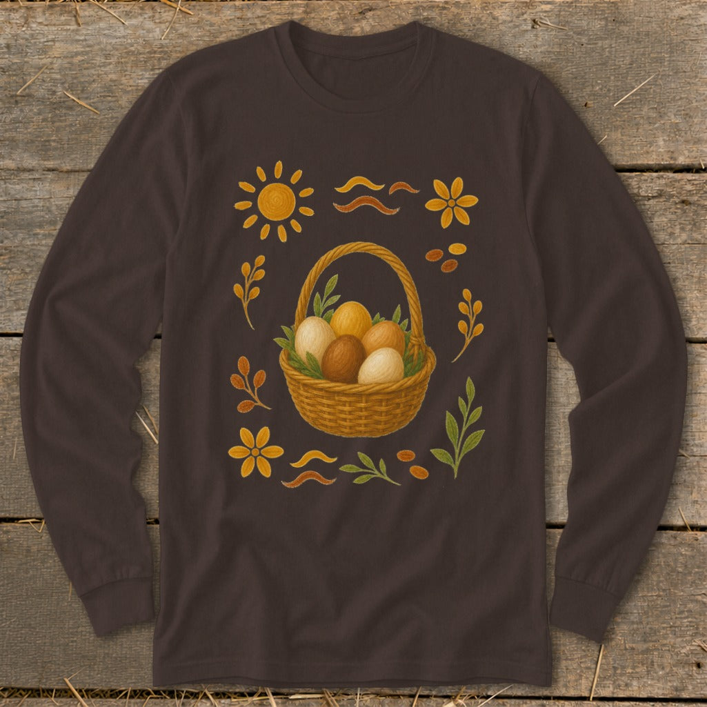 Long-sleeve brown shirt with Easter basket of eggs and floral, sun, and leaf motifs.
