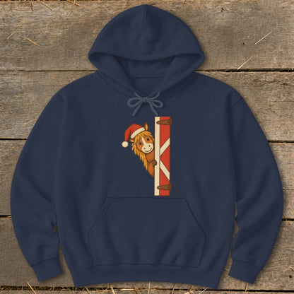 Navy hoodie with a cartoon horse wearing a Santa hat peeking from behind a barn door.