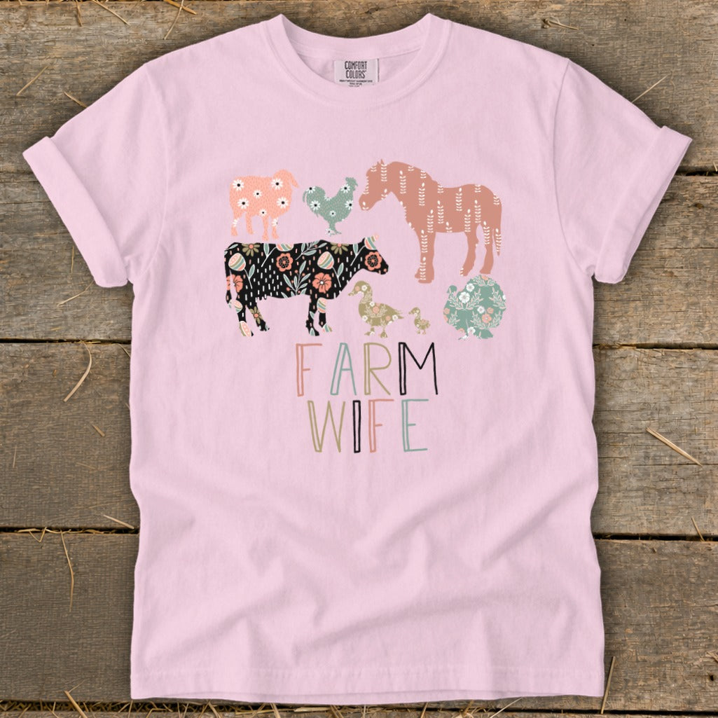 Pink t-shirt with illustrated farm animals and "Farm Wife" text.