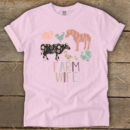 Pink t-shirt with illustrated farm animals and "Farm Wife" text.