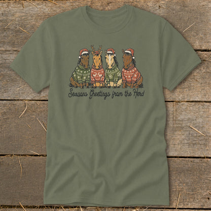 Four horses wearing Santa hats and ugly sweaters with "Seasons Greetings from the Herd" text.