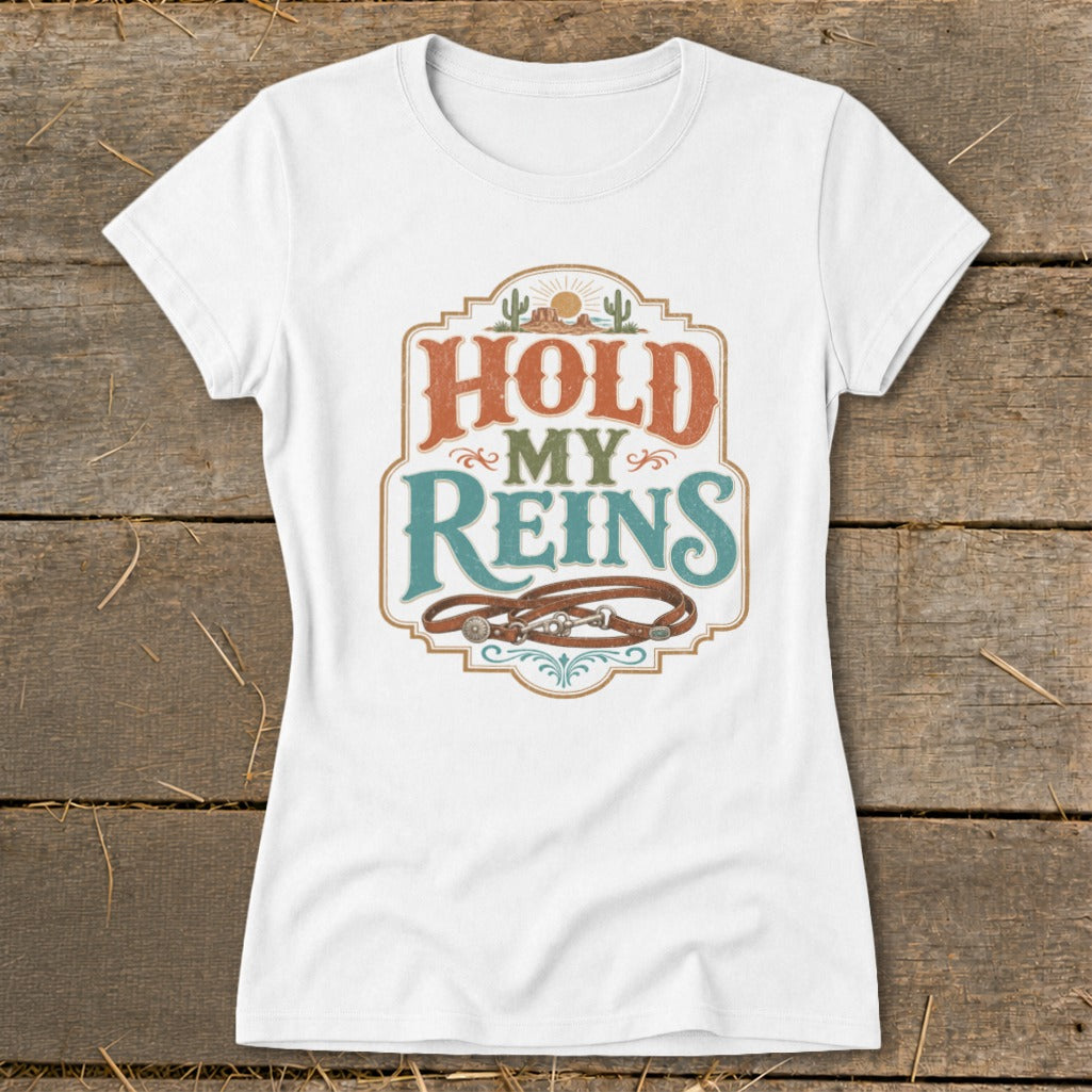 White t-shirt with "HOLD MY REINS" text and a horse bridle design.