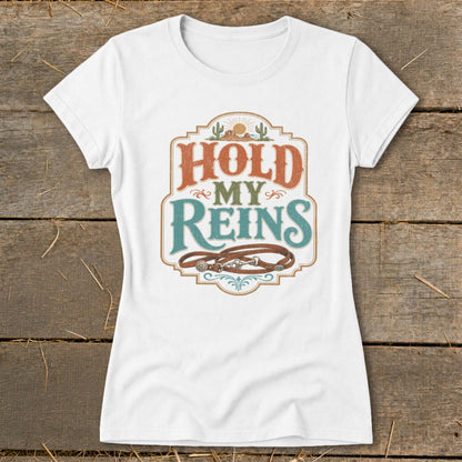 White t-shirt with "HOLD MY REINS" text and a horse bridle design.