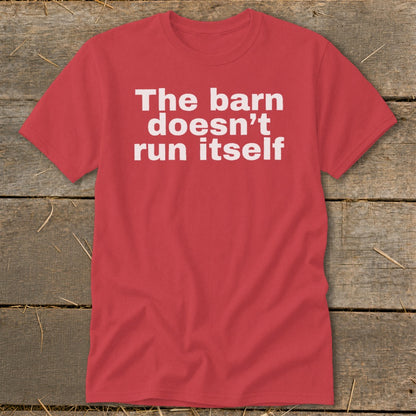 Red t-shirt with white text reading "The barn doesn't run itself".