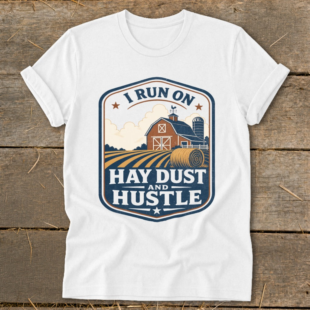 White t-shirt with "I RUN ON HAY DUST AND HUSTLE" farm graphic.