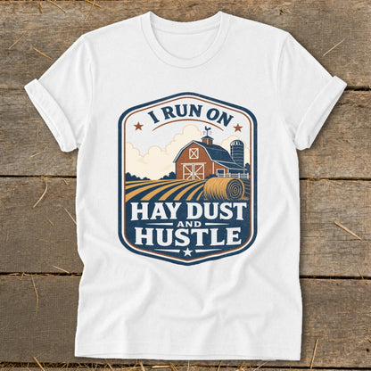 White t-shirt with "I RUN ON HAY DUST AND HUSTLE" farm graphic.