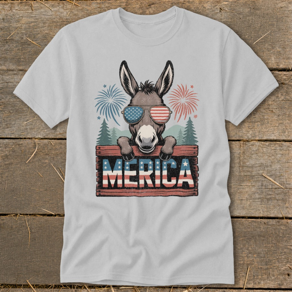 Donkey wearing sunglasses on a wooden sign that says "MERICA" with fireworks.