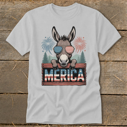 Donkey wearing sunglasses on a wooden sign that says "MERICA" with fireworks.