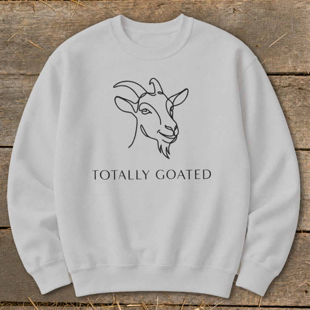 Light gray sweatshirt with a black line drawing of a goat and text reading "TOTALLY GOATED".