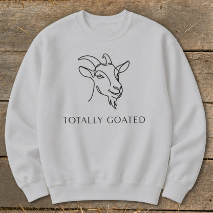 Light gray sweatshirt with a black line drawing of a goat and text reading "TOTALLY GOATED".