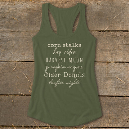 Olive green tank top with text "corn stalks hay rides HARVEST MOON pumpkin wagons Cider Donuts bonfire nights".