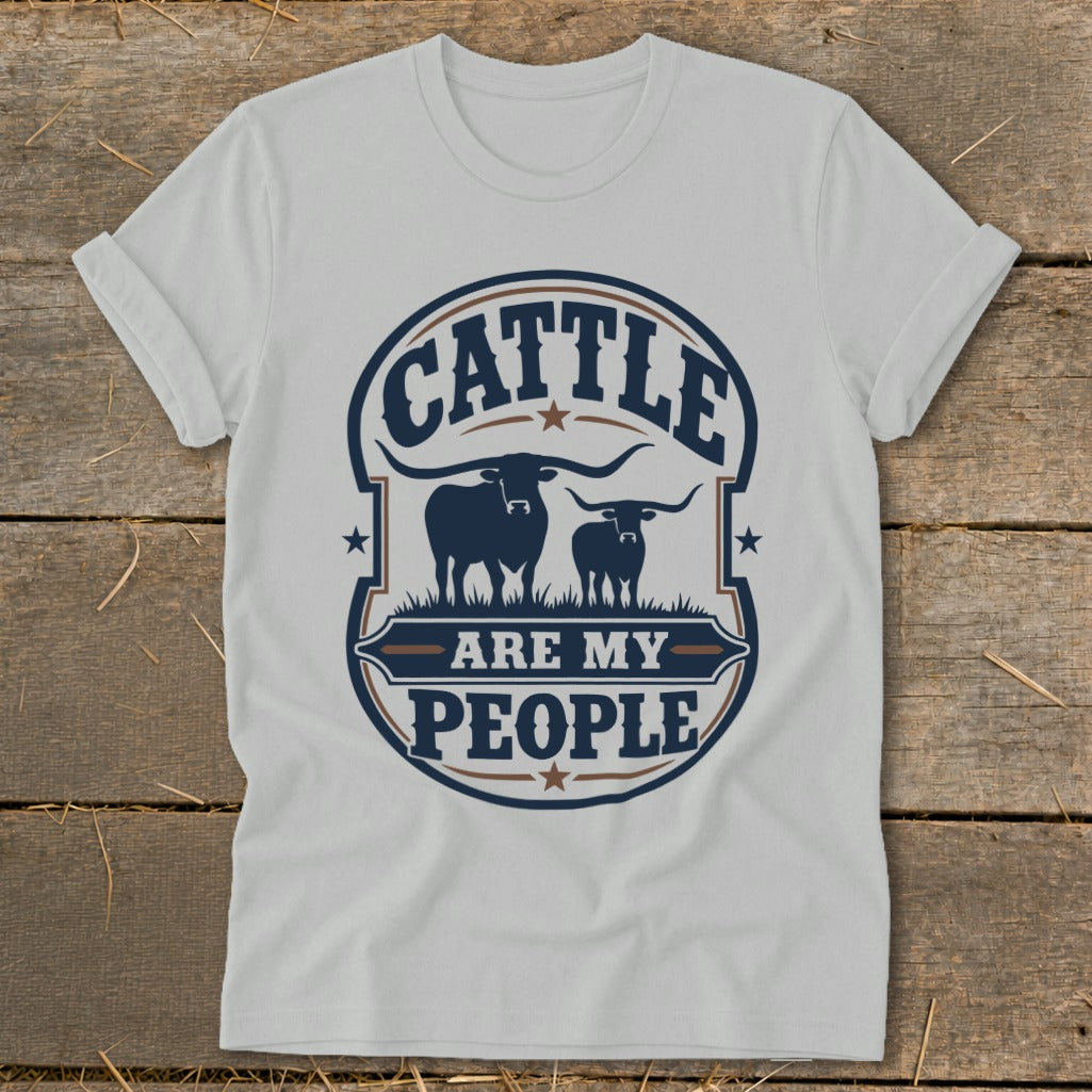 White t-shirt with "Cattle Are My People" text and two longhorn cows graphic.
