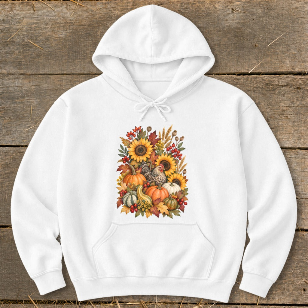 White hoodie with a floral arrangement of sunflowers, pumpkins, gourds, chickens, and autumn leaves.