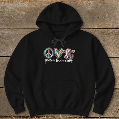 Black hoodie with "peace love cows" graphic featuring a peace sign, hearts, and a colorful cow.