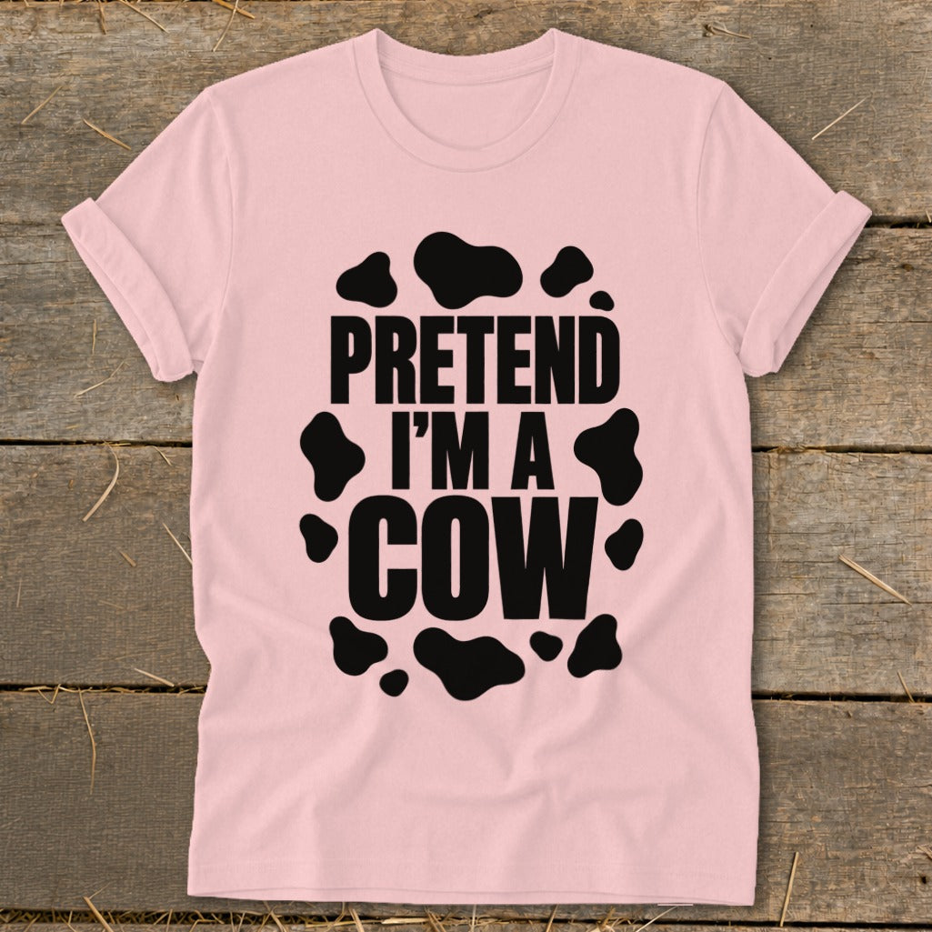 Pink t-shirt with black cow spots and text "PRETEND I'M A COW".