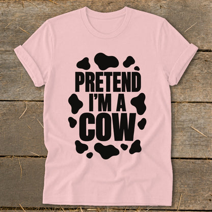 Pink t-shirt with black cow spots and text "PRETEND I'M A COW".
