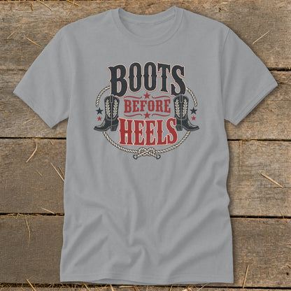 Grey t-shirt with "BOOTS BEFORE HEELS" graphic featuring cowboy boots.