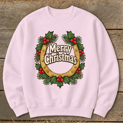 Pink sweatshirt with a horseshoe, holly, and "Merry Christmas" text graphic.